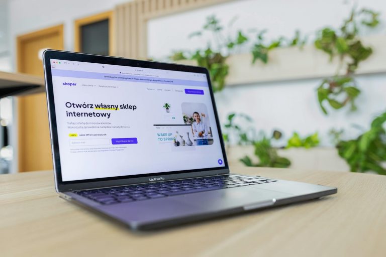 E-commerce automation workspace with multiple screens showing AI dashboards, product catalogs, analytics charts, modern office setup, clean professional lighting, technology atmosphere, laptop computer screens — Formations 90